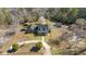 Captivating aerial view showcasing the home's location amidst lush trees and its well-manicured surroundings at 450 Deer Spring Loop, Georgetown, SC 29440