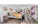 Spacious bedroom with wood floors, a cow print bedspread, and a cozy staircase at 450 Deer Spring Loop, Georgetown, SC 29440