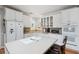 A well-lit kitchen featuring white cabinets, countertop appliances and a large island at 450 Deer Spring Loop, Georgetown, SC 29440