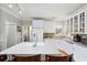 Kitchen featuring an island with seating and appliances in front of all white cabinets at 450 Deer Spring Loop, Georgetown, SC 29440