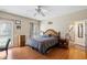 Bedroom with hardwood flooring, windows for natural light, and simple decor at 450 Deer Spring Loop, Georgetown, SC 29440