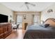 Comfortable main bedroom featuring a ceiling fan, vanity area, and windows for natural light at 450 Deer Spring Loop, Georgetown, SC 29440