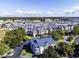A beautiful marina community boasts views of boats, green trees, and neighborhood parking areas at 4637 Lightkeepers Way # 4-A, Little River, SC 29566