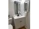 Updated bathroom featuring a modern vanity, round mirror, and stylish fixtures at 4637 Lightkeepers Way # 4-A, Little River, SC 29566