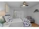 Bedroom with a blue and white flower patterned comforter and a striped chair at 4637 Lightkeepers Way # 4-A, Little River, SC 29566
