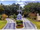 Community entrance with sign, mature trees, and landscaping at 4637 Lightkeepers Way # 4-A, Little River, SC 29566