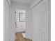 Hallway view showcasing the entry to the bathroom and multiple closets at 4637 Lightkeepers Way # 4-A, Little River, SC 29566