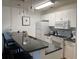 Well-lit kitchen featuring modern stainless appliances, granite countertops, and stylish pendant lighting at 4637 Lightkeepers Way # 4-A, Little River, SC 29566