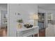 Bright living room detail with sliding doors to screened porch. Includes furniture and wall decor at 4637 Lightkeepers Way # 4-A, Little River, SC 29566