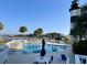 Beautiful community pool with lounge seating, tables and a view of the inter-coastal waterway at 4637 Lightkeepers Way # 4-A, Little River, SC 29566