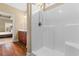 Bathroom featuring a shower, wood-look floors and vanity with ample storage at 494 Battey Dr., Myrtle Beach, SC 29588