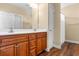 Bathroom featuring a double vanity, ample storage, and wood-look flooring at 494 Battey Dr., Myrtle Beach, SC 29588