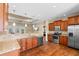 Open kitchen showcasing granite counters, stainless steel appliances, wood cabinets and hardwood floors at 494 Battey Dr., Myrtle Beach, SC 29588