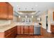 Spacious kitchen featuring granite countertops, stainless steel appliances and a bar with view into the living area at 494 Battey Dr., Myrtle Beach, SC 29588