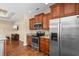 Gourmet kitchen featuring hardwood floors, granite countertops, stainless steel appliances and wood cabinets at 494 Battey Dr., Myrtle Beach, SC 29588