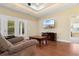 Inviting living room with hardwood floors, TV, and access to the outdoor patio at 494 Battey Dr., Myrtle Beach, SC 29588
