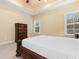 A bright main bedroom with a decorative ceiling fan and large windows at 494 Battey Dr., Myrtle Beach, SC 29588