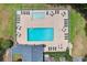 Aerial view of community pool and amenities, including lounge chairs and tables with umbrellas at 494 Battey Dr., Myrtle Beach, SC 29588