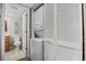 Bathroom features a toilet, vanity, washer, dryer and closet with louvered doors at 501 Maison Dr. # F-1, Myrtle Beach, SC 29572