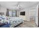 Bedroom featuring a ceiling fan, large dresser, and sliding glass doors with scenic views at 501 Maison Dr. # F-1, Myrtle Beach, SC 29572
