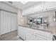Kitchen features stainless steel sink, white cabinetry, and a pass-through to the living area at 501 Maison Dr. # F-1, Myrtle Beach, SC 29572