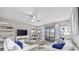 Bright living room features comfortable seating, ceiling fan, and sliding glass doors to a screened porch at 501 Maison Dr. # F-1, Myrtle Beach, SC 29572