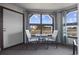 Enclosed outdoor patio with two chairs, a table, and beautiful views of the marsh at 501 Maison Dr. # F-1, Myrtle Beach, SC 29572
