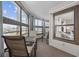 Enclosed outdoor patio featuring chairs, a table, and views of the marsh and the city at 501 Maison Dr. # F-1, Myrtle Beach, SC 29572