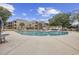 Exterior daytime view of swimming pool surrounded by palm trees and condo buildings at 501 Maison Dr. # F-1, Myrtle Beach, SC 29572