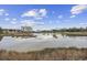 Scenic water view featuring high-rise condos reflecting in a tranquil body of water at 501 Maison Dr. # F-1, Myrtle Beach, SC 29572