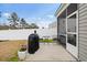 Backyard with a patio with seating and a grill in a fenced yard at 5064 Wavering Place Loop, Myrtle Beach, SC 29579