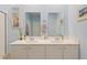 Bright bathroom featuring double sinks, quartz countertops, and ample cabinet space at 5064 Wavering Place Loop, Myrtle Beach, SC 29579