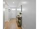 Hallway featuring a light wood floors and decoratively appointed console table at 5064 Wavering Place Loop, Myrtle Beach, SC 29579