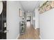 Inviting hallway with light wood floors and tastefully decorated console table at 5064 Wavering Place Loop, Myrtle Beach, SC 29579