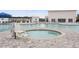 Inviting community hot tub and pool with comfortable lounge seating and shade umbrellas at 5064 Wavering Place Loop, Myrtle Beach, SC 29579