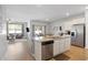 Bright kitchen featuring an island with granite countertops, stainless steel appliances, and an open concept design at 5064 Wavering Place Loop, Myrtle Beach, SC 29579