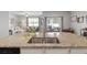 Modern kitchen featuring granite countertops, stainless steel sink, and view of the breakfast nook and living room at 5064 Wavering Place Loop, Myrtle Beach, SC 29579