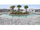 Picturesque lazy river with lush landscaping, palm trees, and relaxing water features at 5064 Wavering Place Loop, Myrtle Beach, SC 29579