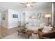 Open living space with neutral tones, cozy seating, and wood-look flooring at 5064 Wavering Place Loop, Myrtle Beach, SC 29579