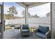 Relaxing screened patio with comfortable seating and view of fenced yard at 5064 Wavering Place Loop, Myrtle Beach, SC 29579