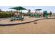 Community playground with slides, climbing structures, and soft landing surfaces for safety at 5064 Wavering Place Loop, Myrtle Beach, SC 29579