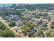 Aerial view of a neighborhood located near a scenic pond, surrounded by lush trees at 508-B Rosemary Ln., North Myrtle Beach, SC 29582