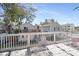 Spacious back deck with white wooden railings and patio furniture with views of neighboring homes at 508-B Rosemary Ln., North Myrtle Beach, SC 29582