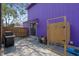 View of the backyard showing a grill, outdoor shower, and access to the home at 508-B Rosemary Ln., North Myrtle Beach, SC 29582