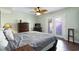 Bedroom with ceiling fan, a dresser, and doors leading to the outside at 508-B Rosemary Ln., North Myrtle Beach, SC 29582