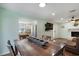 Open floor plan: dining room open to kitchen with stainless refrigerator and the living room at 508-B Rosemary Ln., North Myrtle Beach, SC 29582