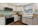 Updated kitchen featuring modern stainless steel appliances and a farmhouse sink at 508-B Rosemary Ln., North Myrtle Beach, SC 29582