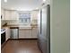 Kitchen with stainless steel appliances, farm sink, wood countertop and floors at 508-B Rosemary Ln., North Myrtle Beach, SC 29582