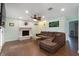 Living room with a brick fireplace, ceiling fan, and comfortable seating at 508-B Rosemary Ln., North Myrtle Beach, SC 29582