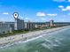Oceanfront condos line the beach with sunny skies in this coastal aerial view at 5308 N Ocean Blvd. # 1003, Myrtle Beach, SC 29577